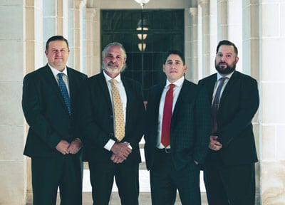 Photo of attorneys: David V. Chipman, Carlos A. Monzón, Raul F. Guerra and Sean M. James